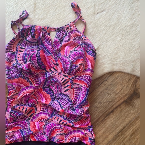 Krista brand one-piece swimsuit with a colorful, patterned top and black bottom - Picture 3 of 8